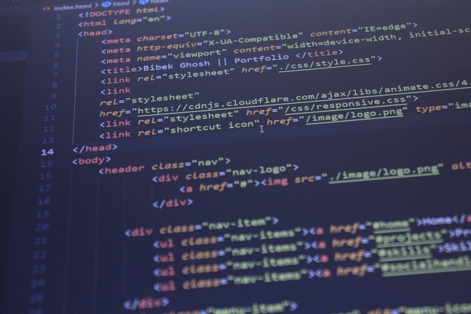 A close-up photograph of a computer screen displaying lines of HTML code, with visible tags such as '<head>', '<body>', and '<div>'. The code is highlighted with syntax coloring, featuring blue, pink,